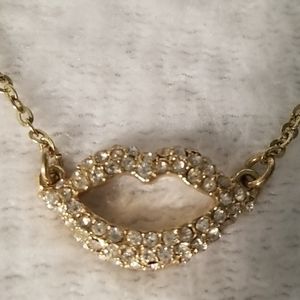 Gold and diamonds lip necklace